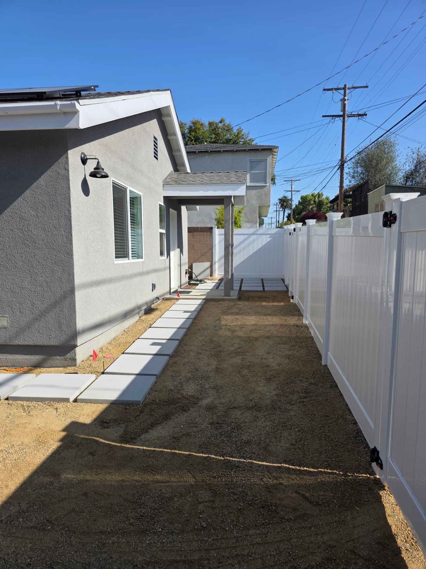 Modern detached ADU exterior at dusk in Los Angeles backyard