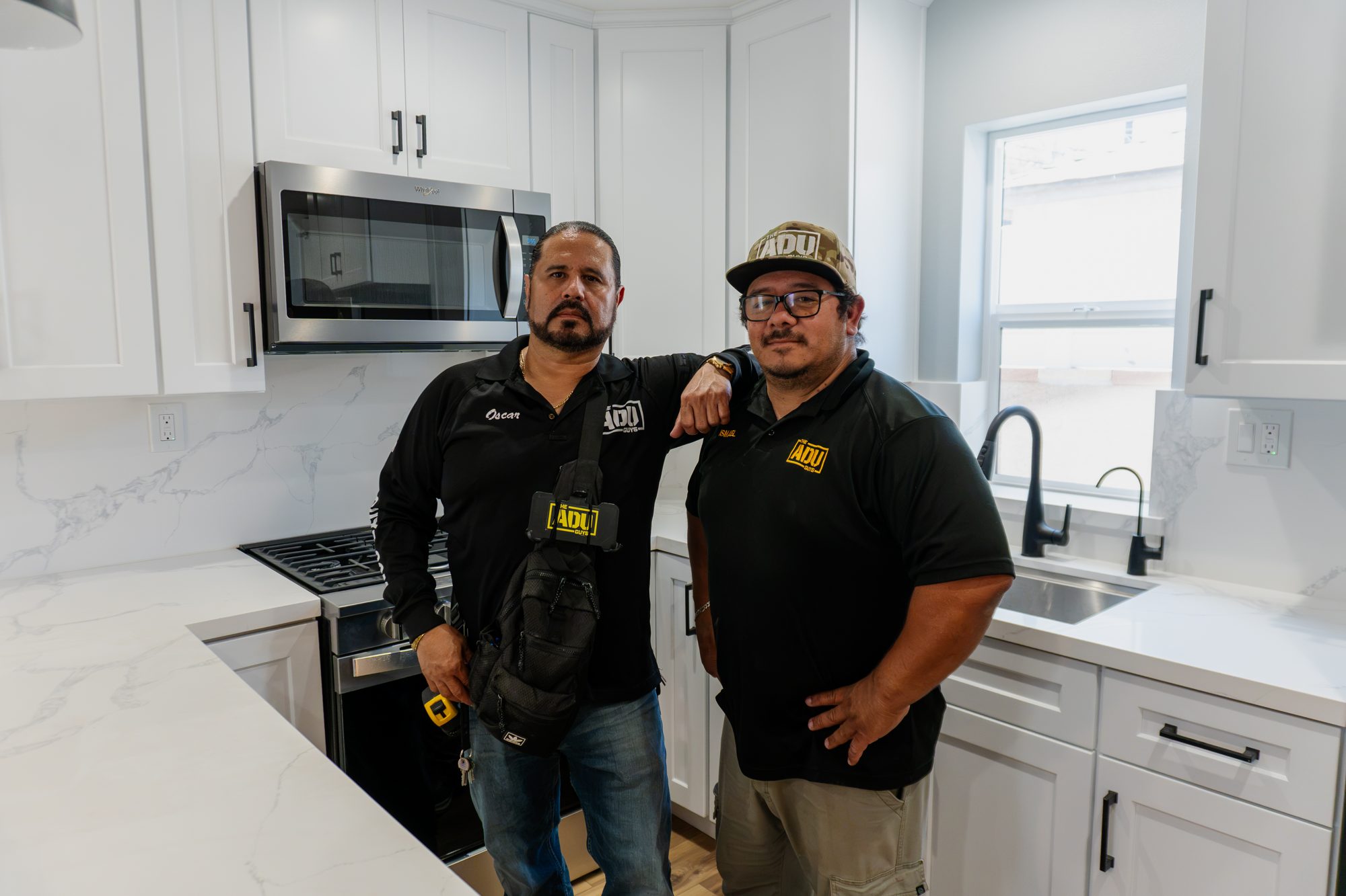 Oscar and his business partner inside a completed ADU kitchen